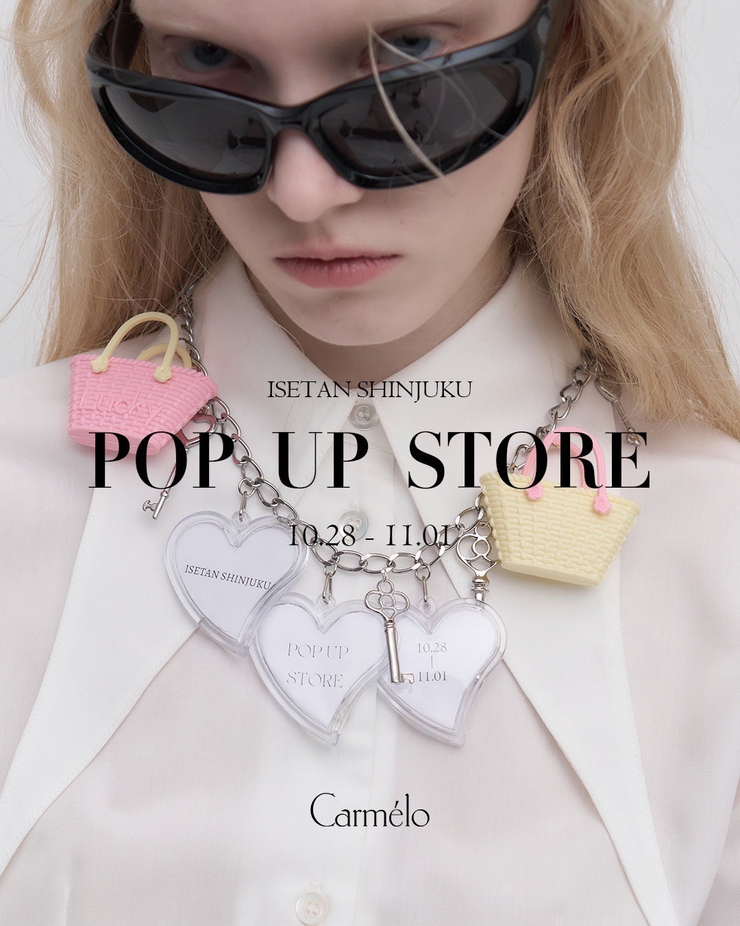 サングラスとチャーム付きチェーンを着けた人物写真に、伊勢丹新宿店POP UP STOREと日付、Carmeloの文字を配した告知画像。